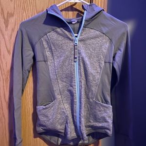 gray zip up with light blue zipper